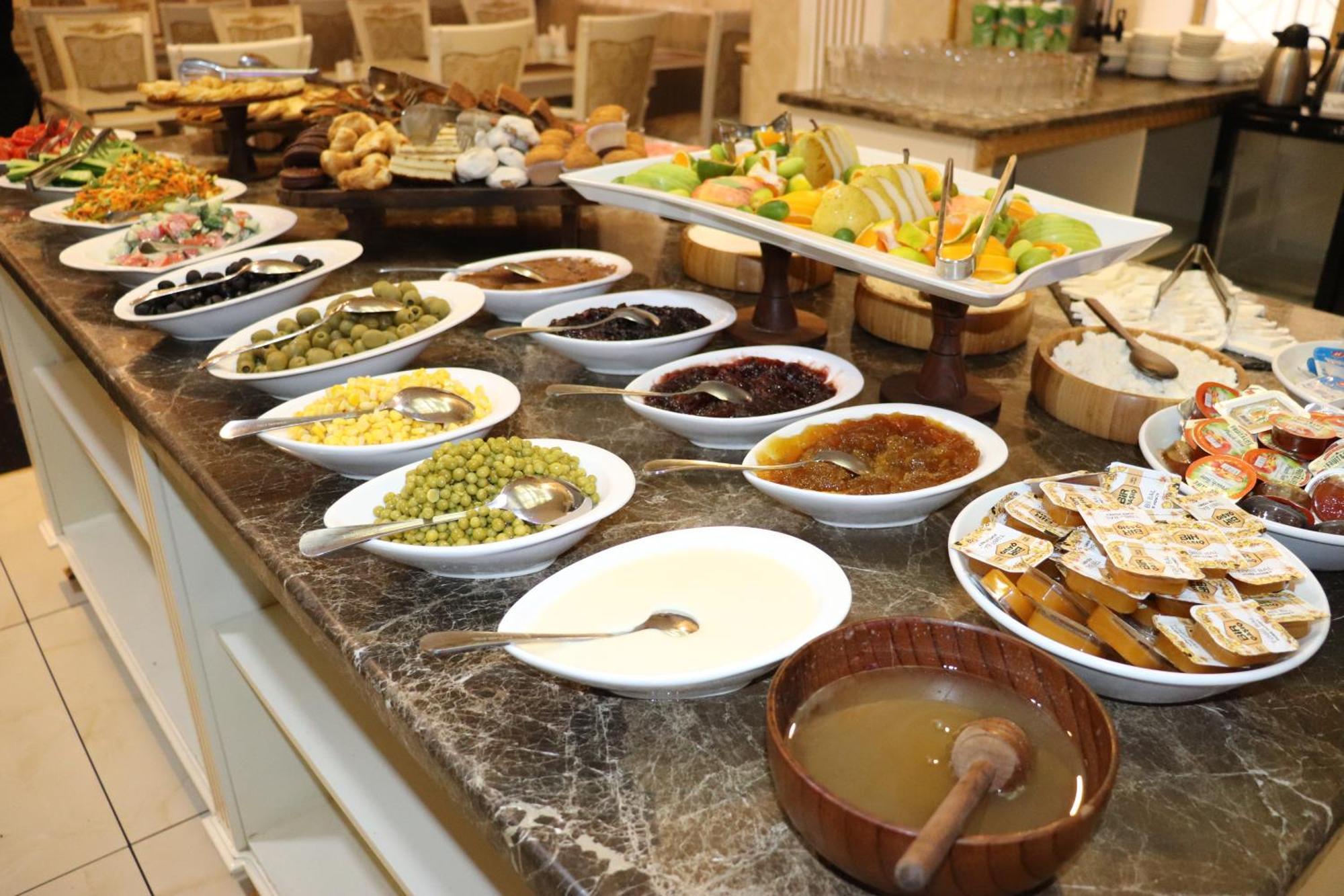 Premier Palace Baku Exterior photo A selection of Israeli salads